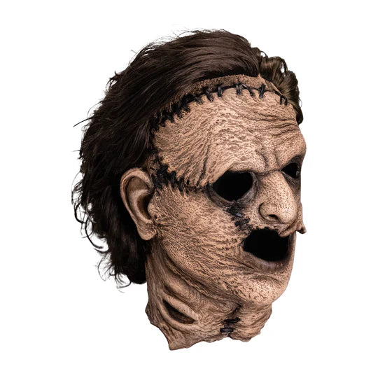The Texas Chainsaw Massacre Leatherface Costume Mask of a full over the head latex mask of Leatherface's gruesome scars and stitches, weathered looking skin, and attached hair, right side profile