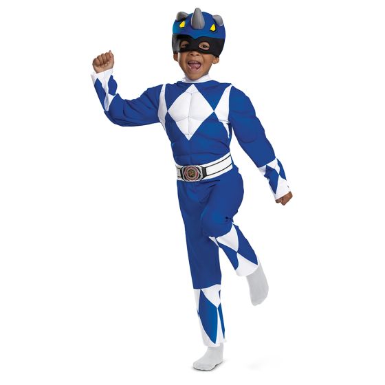 Boy in the Toddlers Mighty Morphin Power Rangers Blue Ranger Muscle Costume Featuring a full-length blue jumpsuit with printed white diamond patterns across the chest and sleeves, this costume includes padded muscle detailing in the torso and arms for a sculpted appearance. The design incorporates an attached belt at the waist with a circular emblem at the center and is paired with a soft character headpiece designed with a dinosaur-inspired shape, including small horn details and eye openings at the front