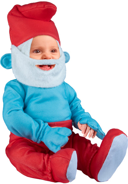 Baby modeling the Toddlers The Smurfs Papa Smurf Costume featuring a one‑piece jumpsuit with a bright blue long‑sleeve upper section with attached hand covers and red pants with attached shoe covers, and topped off with the signature red Papa Smurf hat with an attached long white beard, front view