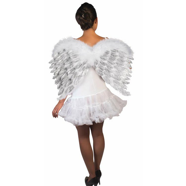 Model wearing White Feather Angel Wings with Silver Glitter Costume Accessory featuring layered white feather wings with a soft, fluffy feather trim along the top edge; detailed with silver glitter accents brushed across the inner feather layers, adding shimmer and contrast while preserving a bright, angelic color palette; designed in a classic curved