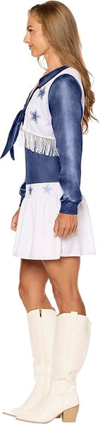 Side view of Woman posing in the  Deluxe Dallas Cowboys Cheerleader Costume Dress Featuring a deluxe cheerleader-style costume dress designed in blue and white with a satin-look finish, long blue sleeves, a blue front tie accent at the neckline, and a white vest-style overlay trimmed with decorative fringe. The dress is detailed with metallic-look star appliqués on the vest and skirt, a fitted blue waistband, and a short white pleated skirt.