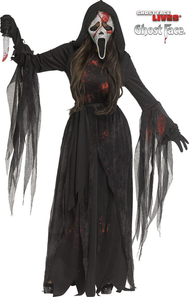 Woman posing in the Womens Scream Bloody Bling Ghost Face Costume Dress featuring a long black hooded dress designed with a fitted bodice and flowing skirt, accented with layered sheer gauze panels and jagged torn-style sleeve drapes for added movement; styled with scattered red “blood splatter” detailing across the fabric and finished with matching black gloves for a complete look. The costume includes a rhinestone‑covered Ghost Face mask embellished with sparkling crystal‑style stones and bold red accents