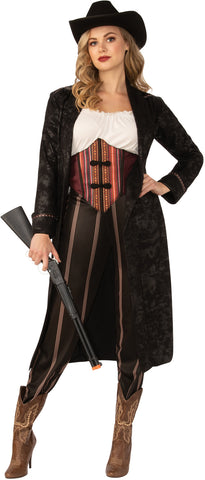 Woman posing in the Womens Wild West Cowgirl Costume Featuring a four-piece western-inspired costume set including a white fitted top with a gathered neckline, a structured waistcoat with red and black striped detailing and front closures, high-waisted brown pants with vertical stripe accents, and a black cowboy hat designed with a curved brim and classic Western shape.