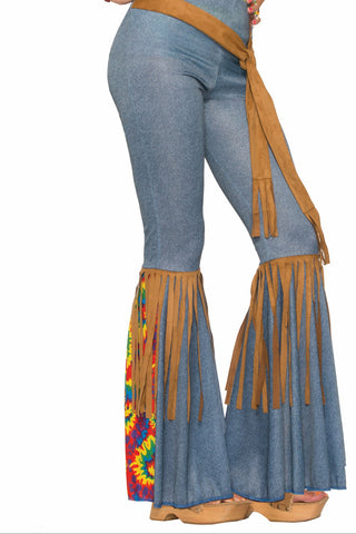Woman wearing the Womens Bell Bottom Hippie Costume Pants with Belt featuring fitted blue denim‑look pants that flare dramatically below the knee into classic bell bottoms; designed with tan suede‑style fringe panels cascading down the legs, accented by a brightly colored retro tie-dye insert peeking through the flare; finished with a wide matching tan belt that ties at the hip and features long fringe ends for added movement and ‘70s flair