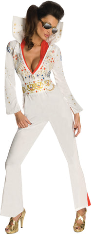 Woman posing in the Womens Deluxe Elvis Presley Aloha from Hawaii Costume which includes a white one‑piece jumpsuit, designed with a dramatic deep V neckline trimmed with the red scarf; embellished across the chest and sleeves with ornate gold, red, and blue jewel‑style accents and star motifs. The jumpsuit is finished with long fitted sleeves that flare slightly at the cuffs, a wide gold decorative belt motif, and structured pant legs that fall into bell‑bottom shape