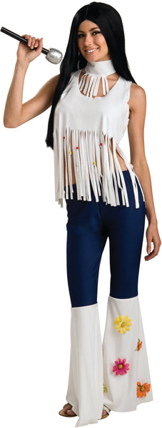 Woman posing in the Womens Groovy Rockstar Costume which features a retro‑inspired look with a sleeveless white fringe top designed with dramatic vertical fringe across the chest and hem, accented with small colorful bead details that add movement and texture; includes a separate matching white choker necklace worn at the neck, creating the layered, stage‑ready look seen in classic late‑’60s and early‑’70s rock fashion. The costume is paired with white bell‑bottom pants flaring below the knee, decorated wit