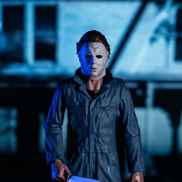 Halloween 1978 Michael Myers 8" Collector's Action Figure Collectible Toy in gray coveralls and white mask while holding a knife cinematic view close up