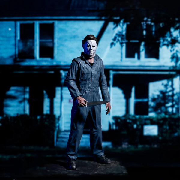 Halloween 1978 Michael Myers 8" Collector's Action Figure Collectible Toy in gray coveralls and white mask while holding a knife cinematic view  