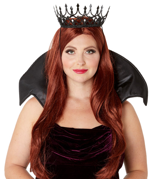 A woman wearing the Black Dark Royalty Queen Crown Costume Accessory featuring an ornate molded crown design finished in deep matte black with raised baroque‑style detailing, pointed arches, and sculpted jewel accents that create a regal, gothic silhouette, secured with an elastic strap and black collar, which is sold separately